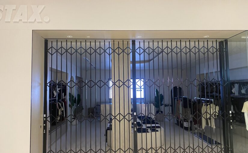 Minimalist designed  Commercial concertina doors for  fashionable activewear retailer